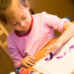 preschool pressure girl finger painting